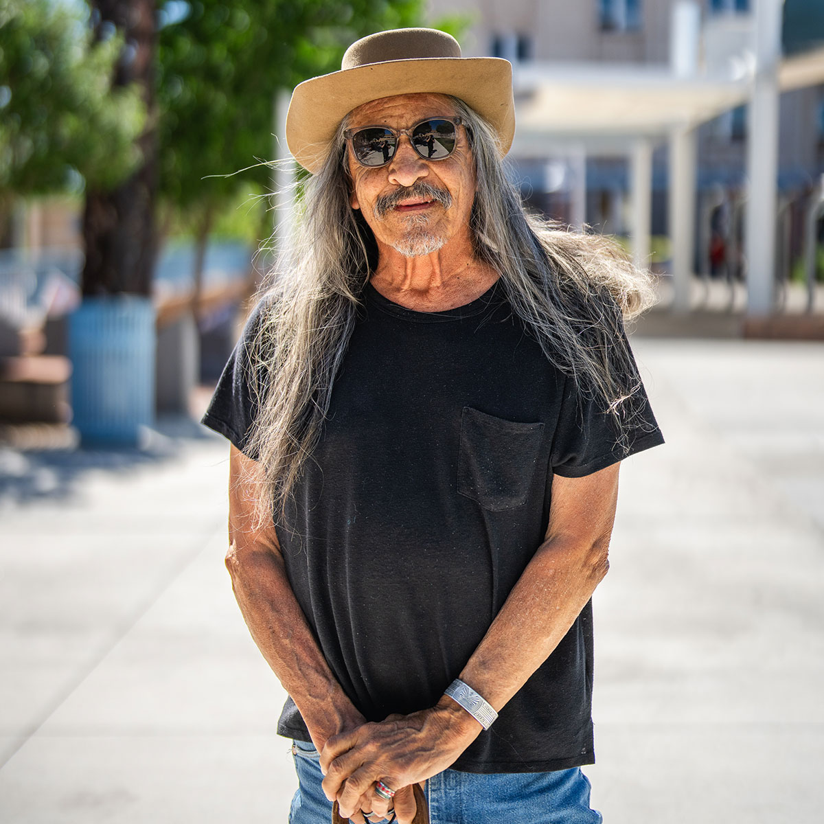 Elder Hispanic man with cane