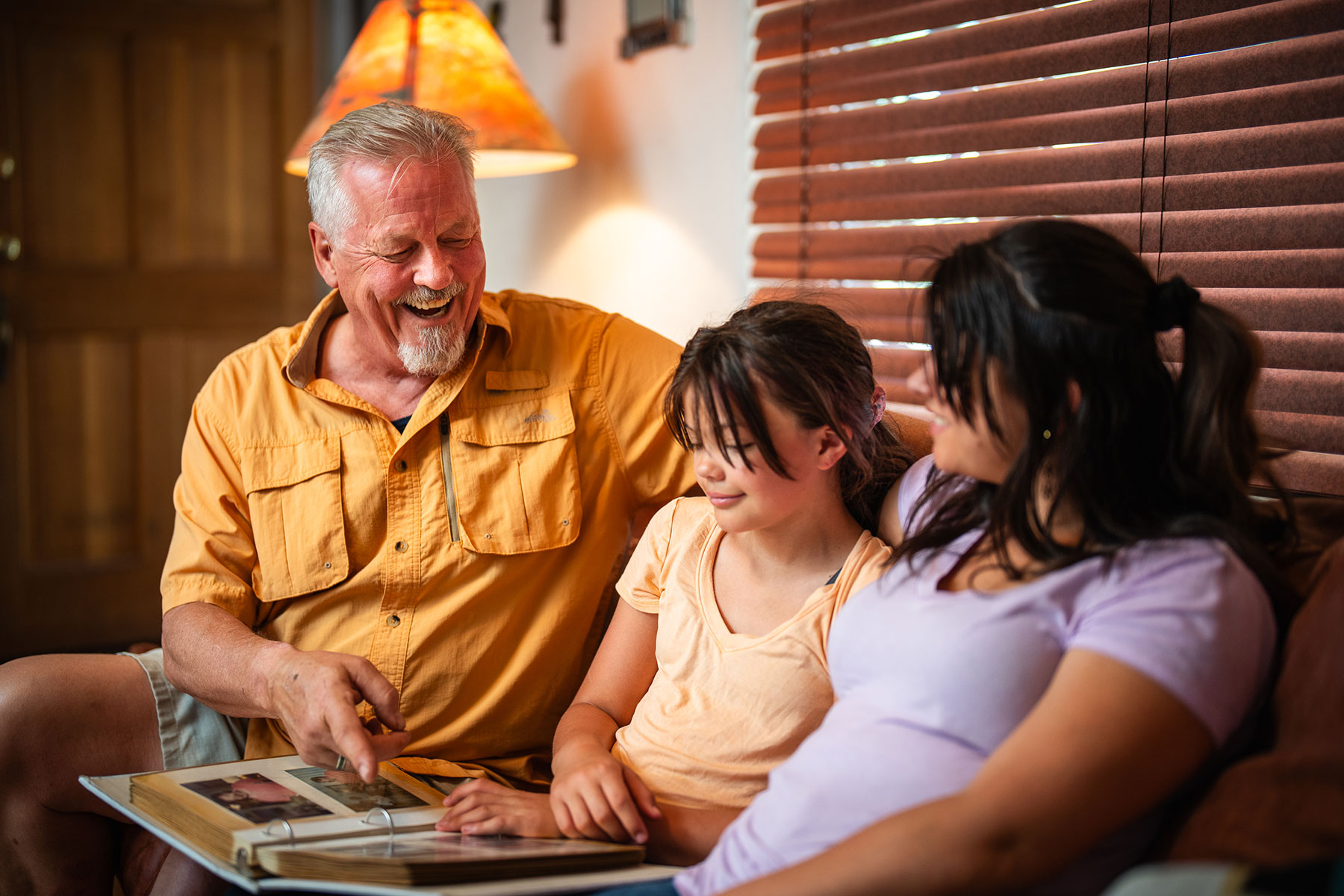 grandpa with kids looking at album